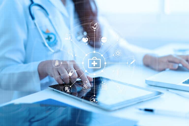 Healthcare professional using digital tablet with medical icons overlay.