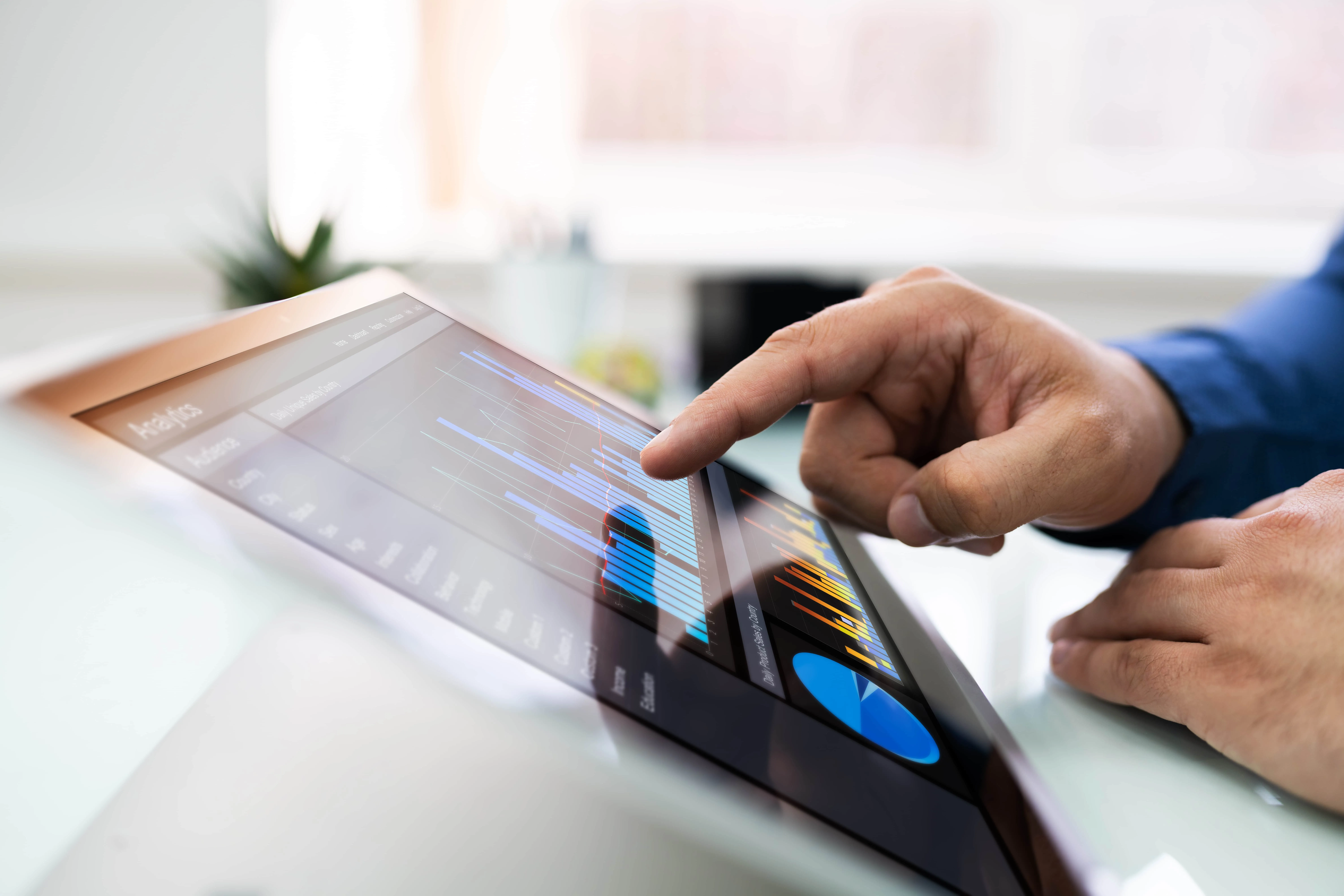 Businessman Analyzing Graph On Laptop