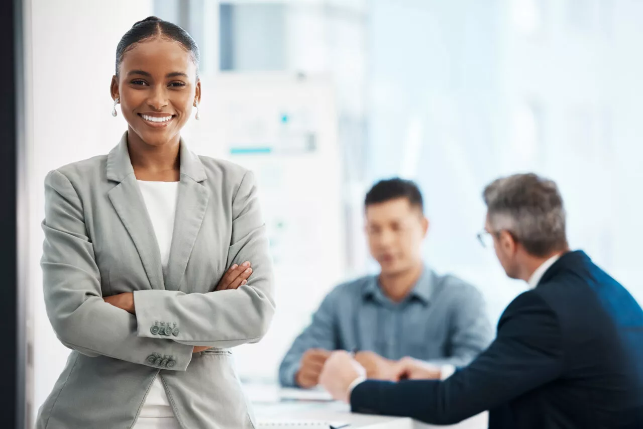 Assistant, intern andor training business woman looking proud, confident and motivated before a boardroom team meeting. Portrait of powerful, ambitious and inspired office corporate with arms crossed