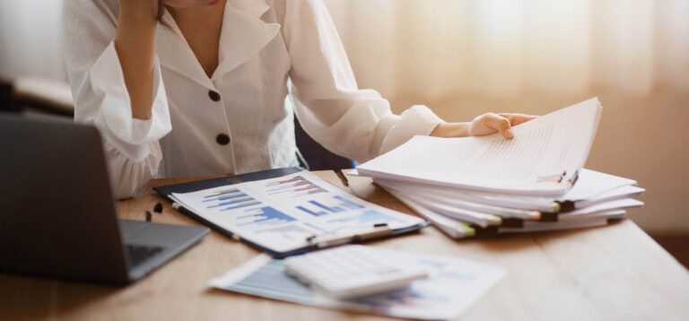 A close-up shot of a stressed business woman working from home o