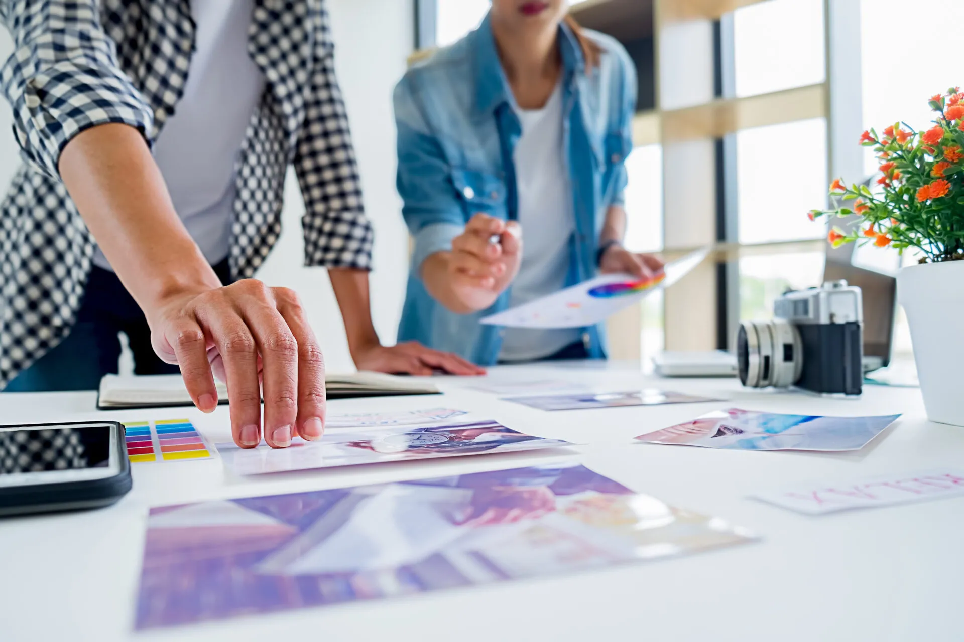 Asian advertising designer creative start up team discussing ide