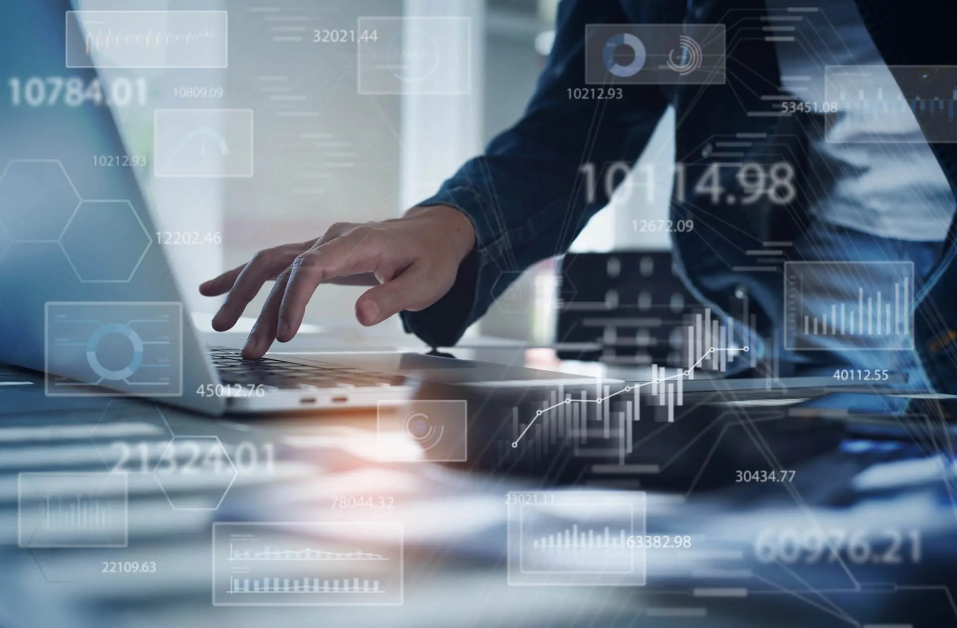 Businesswoman working on laptop computer analyzing sales data an