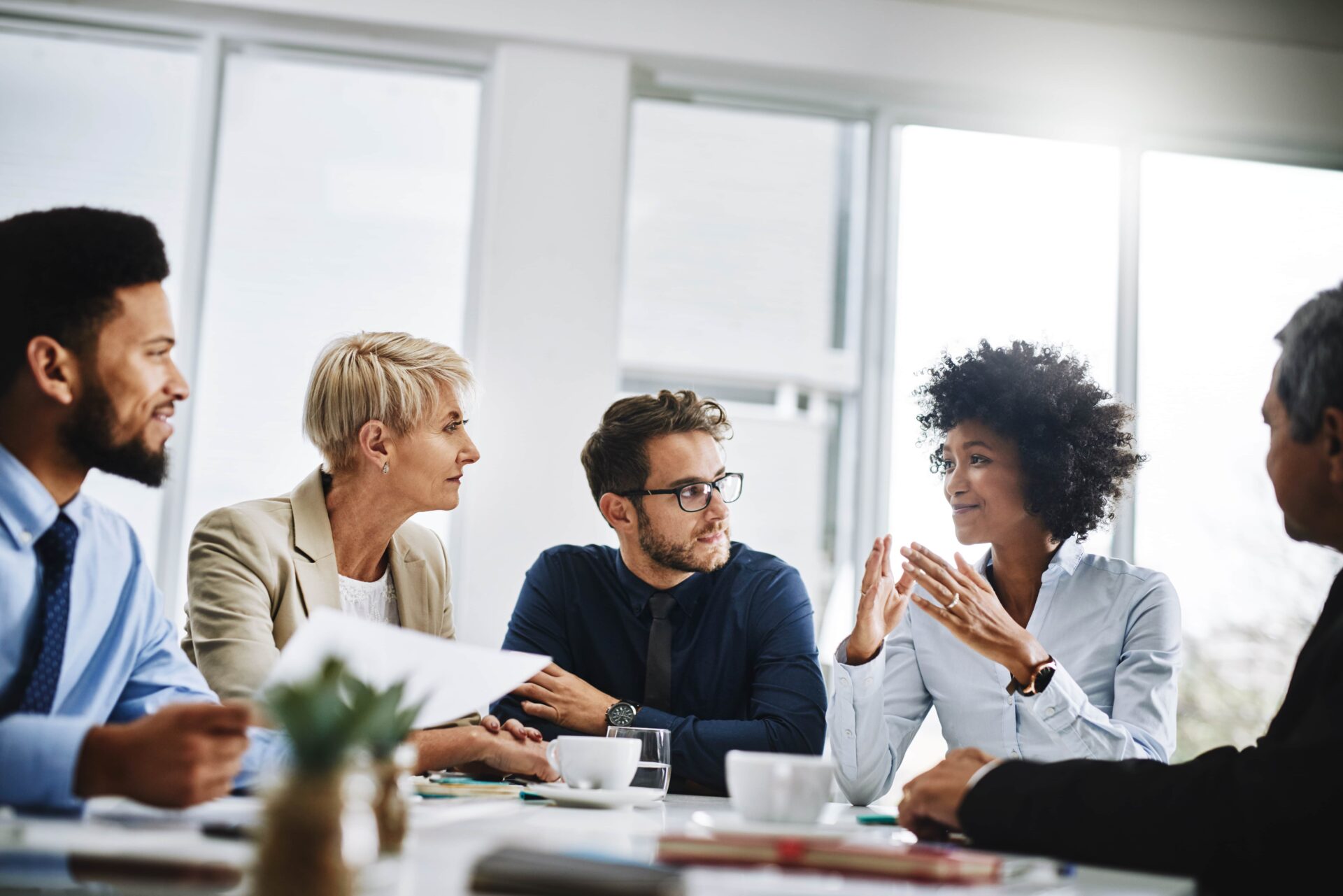 We will only win by working together. Shot of a group of businesspeople sitting together in a meeting.