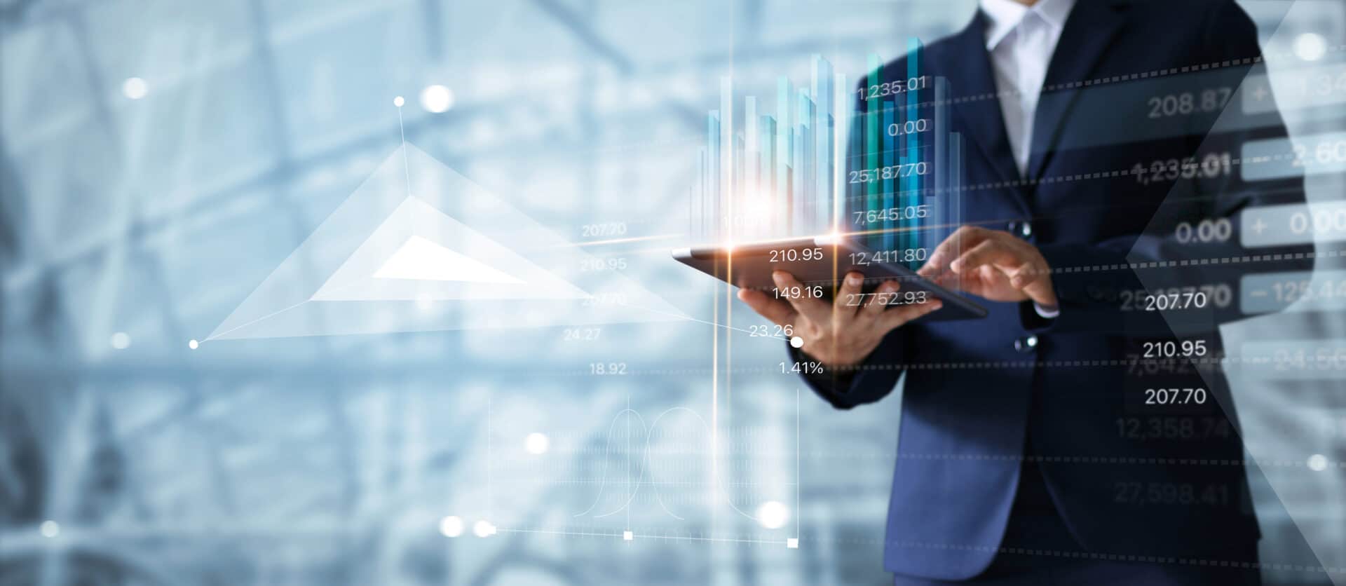 Businessman using tablet analyzing sales data and economic growt