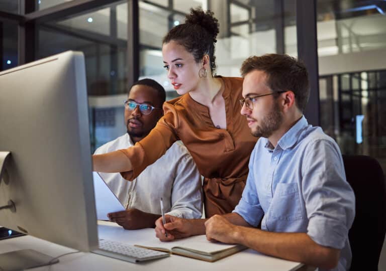 Team collaborating on a project in a modern office setting.