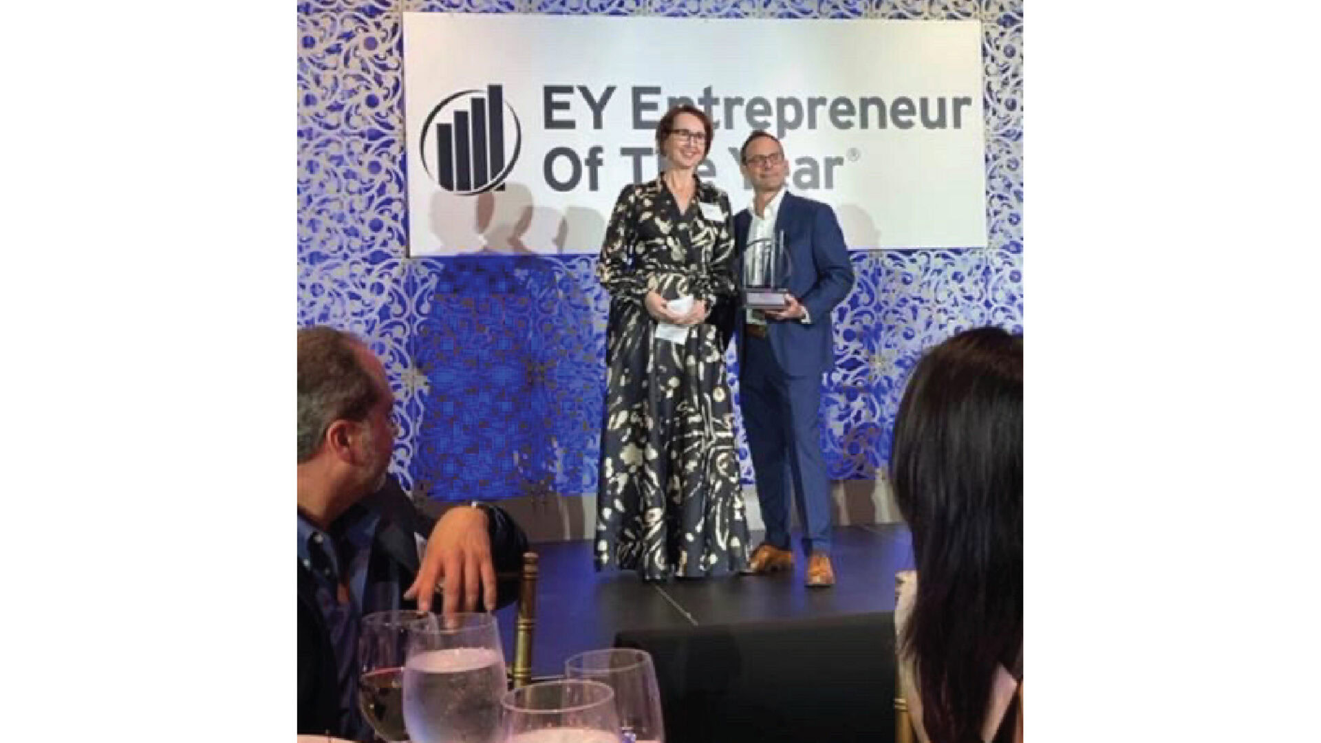 Aptive Resources CEO Rachele Cooper receiving EY Entrepreneur of the Year award.