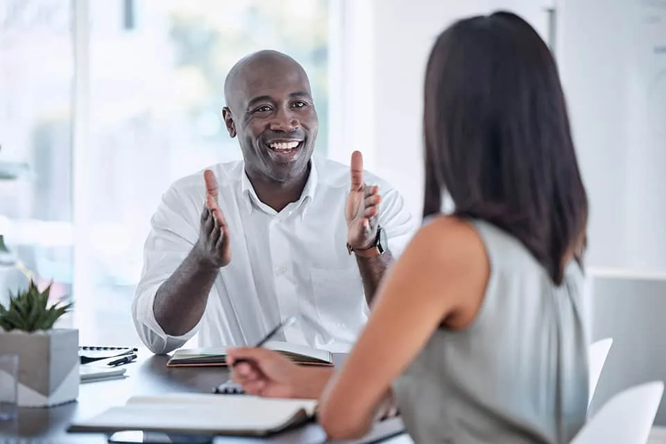 Collaboration, teamwork and business people meeting for kpi review, project development update and office b2b communication. Corporate black man talking to woman client or employee on job negotiation