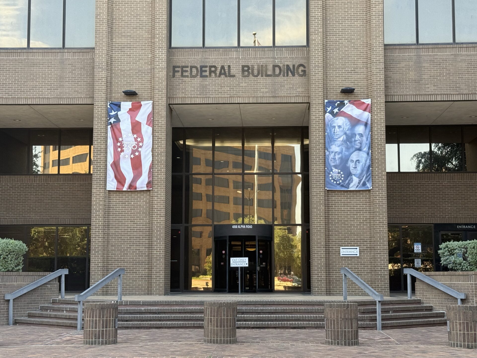 Federal Building with patriotic banners celebrating America's 250th birthday.